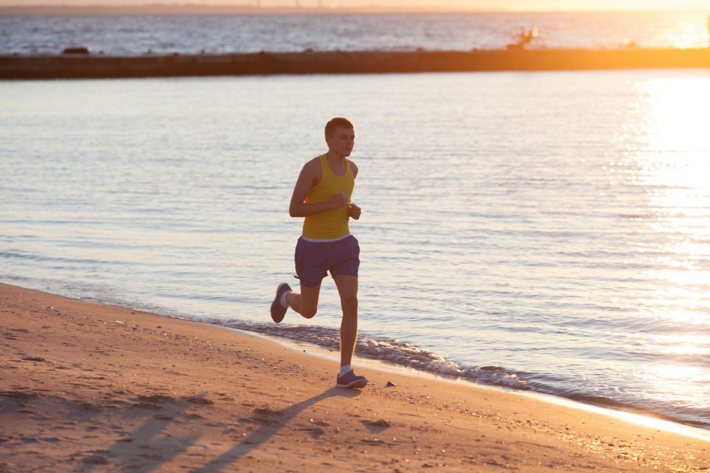 Beachside running sunrise or sunset