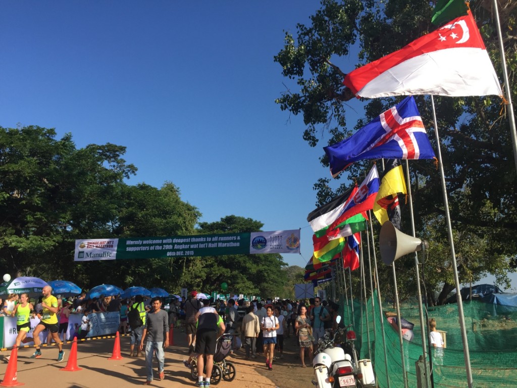 Flags from all participating nations line the finishing path