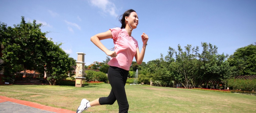 woman running outdoors training at park
