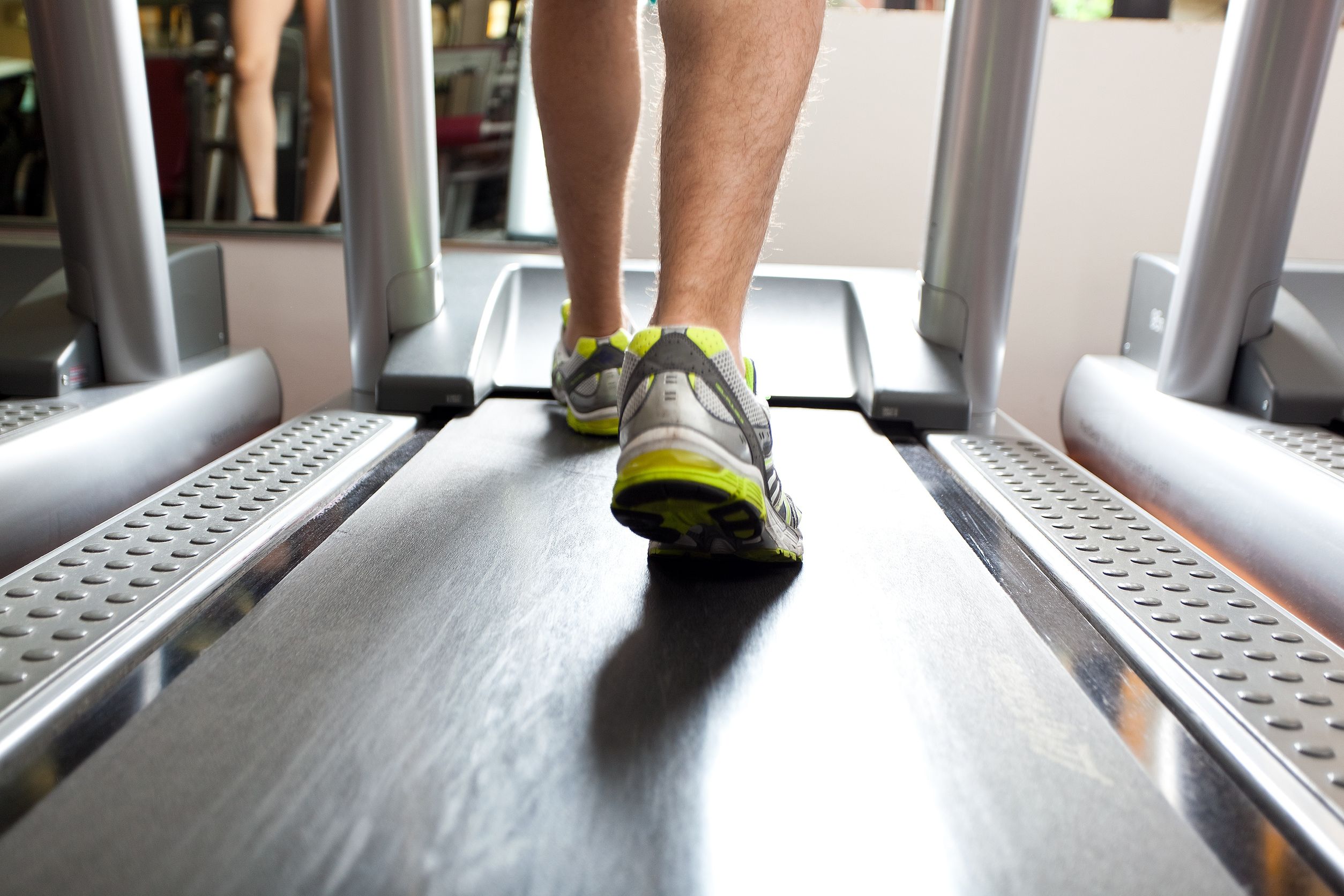 Legs train. Using a Treadmill. Close-up of the Gym environment. Tread Mill stock.