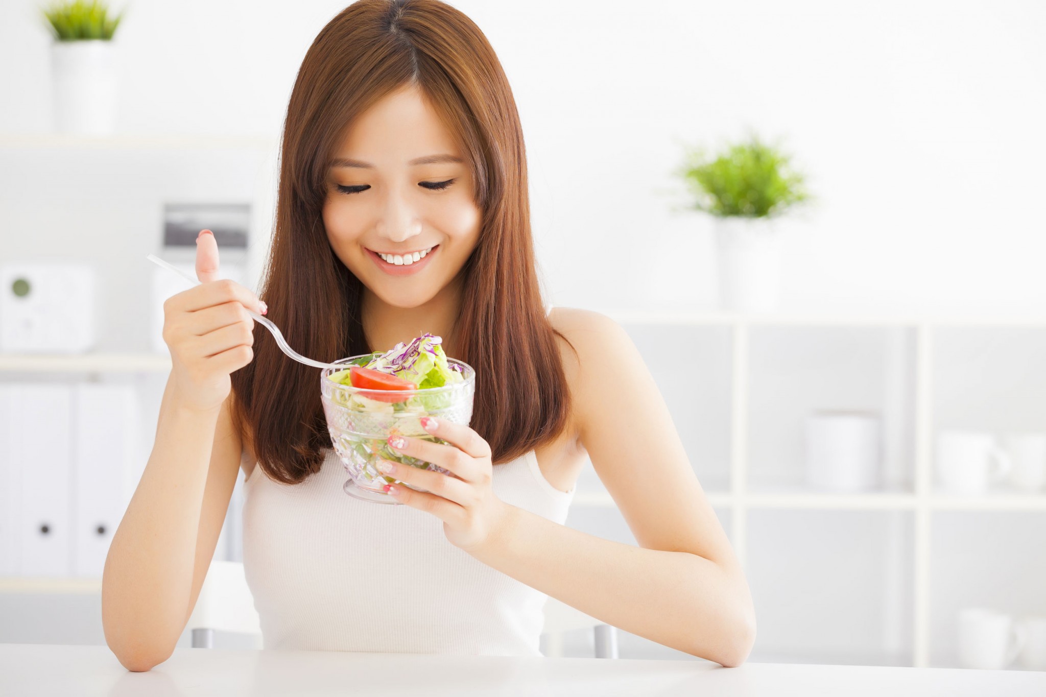 asian-young-woman-eating-healthy-food