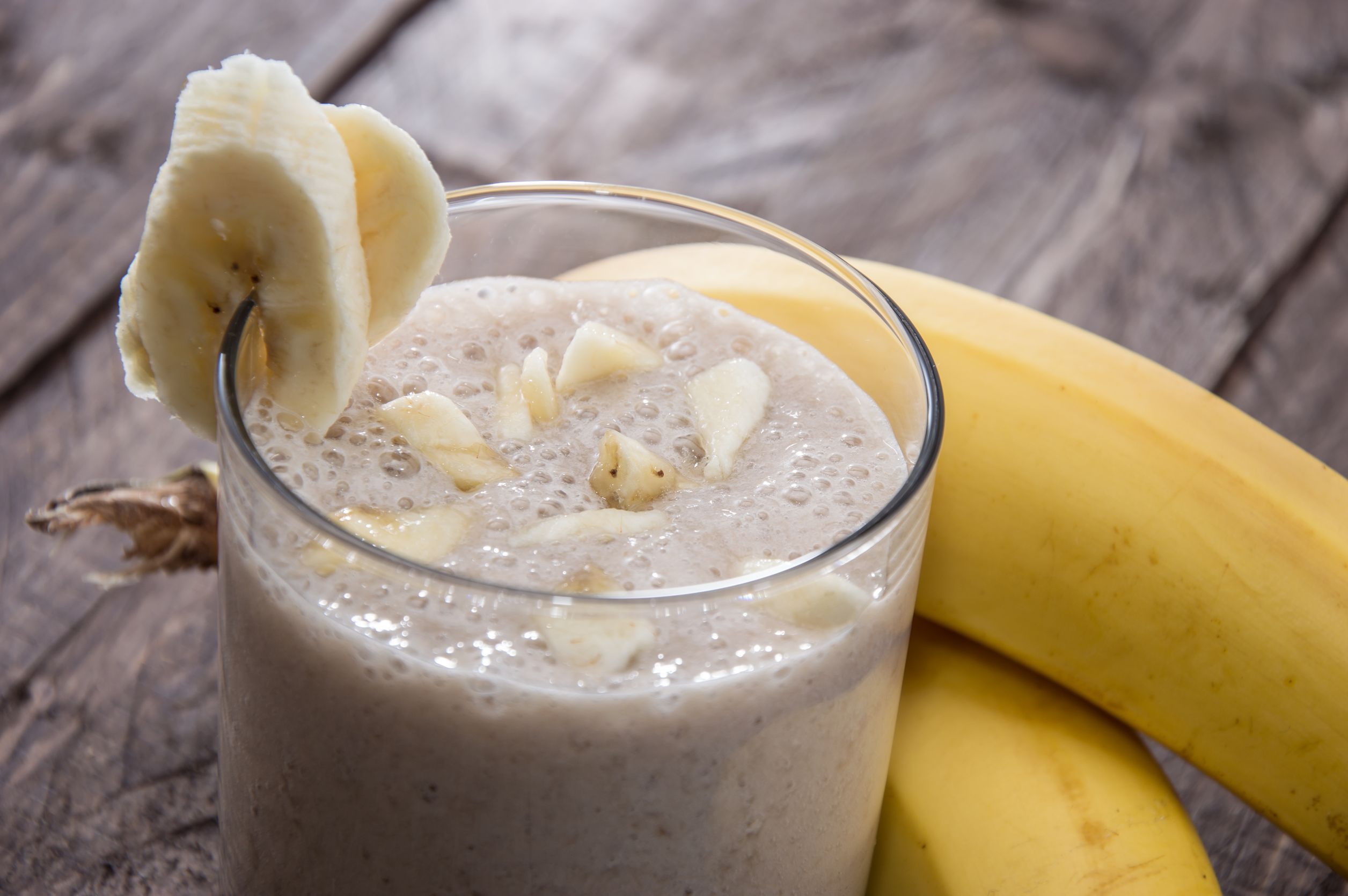 banana-milkshake-on-wooden-background